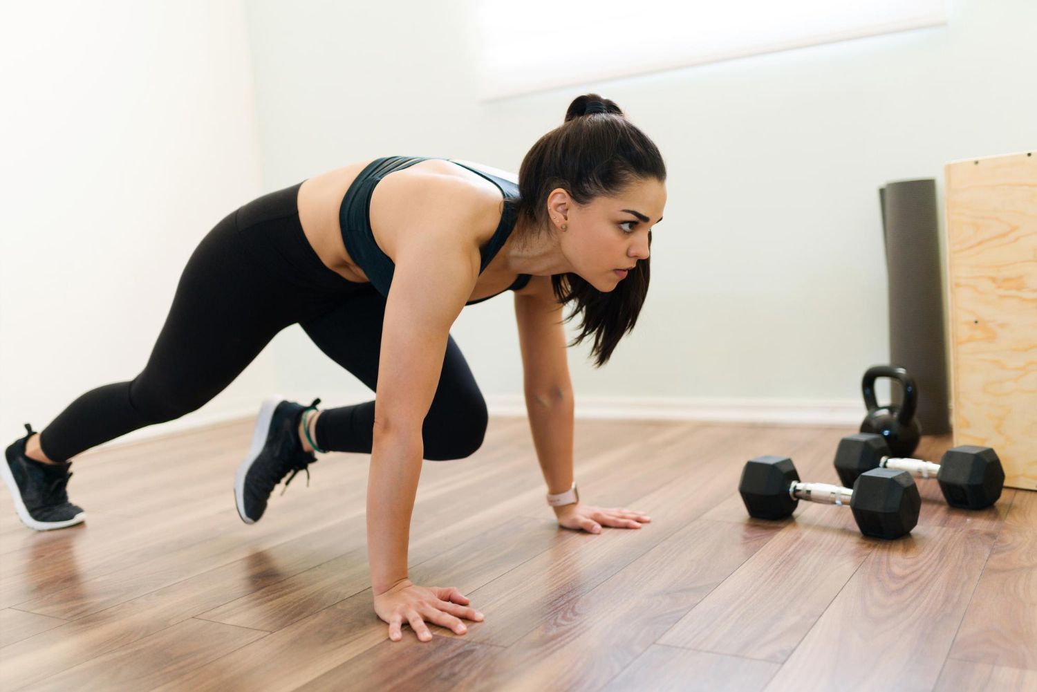 exercising-home-with-high-intensity-interval-training-program-fitness-woman-doing-mountain-climbers-cardio-workout high-intensity interval training